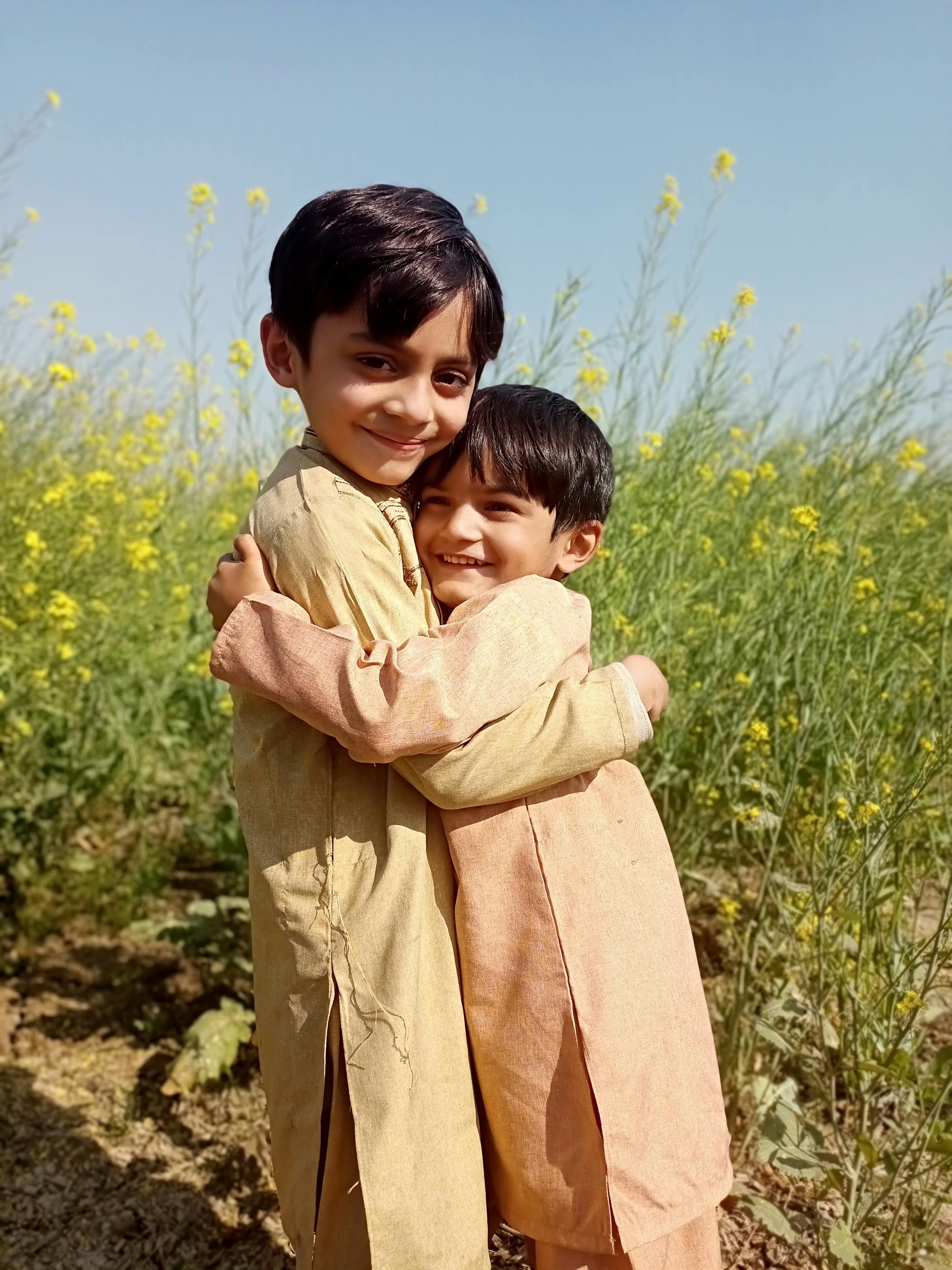 Two children sharing a warm, close moment together